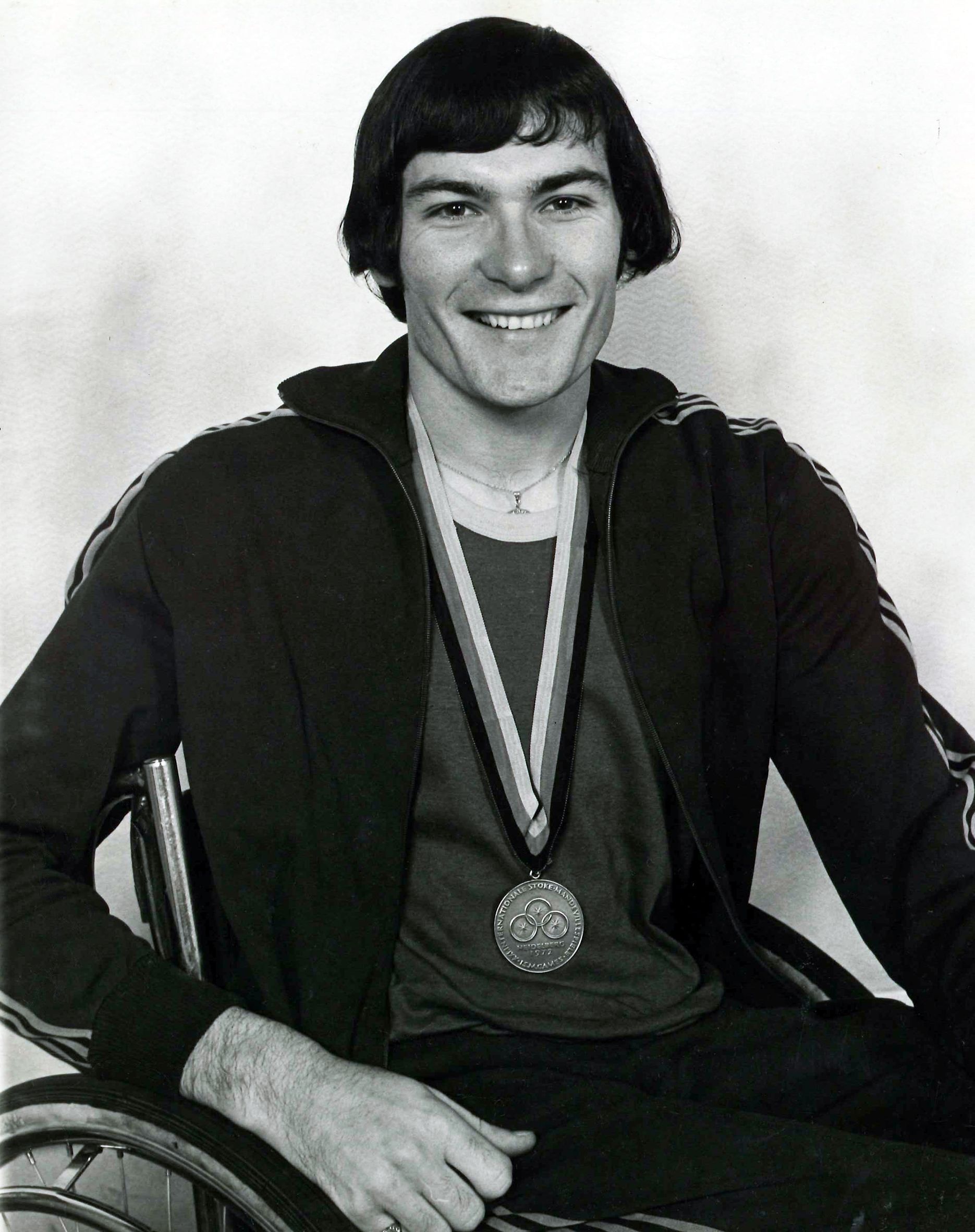 Ray Barrett with the bronze medal he won in the Men's 100m Wheelchair 2 event at the 1972 Paralympic Games.