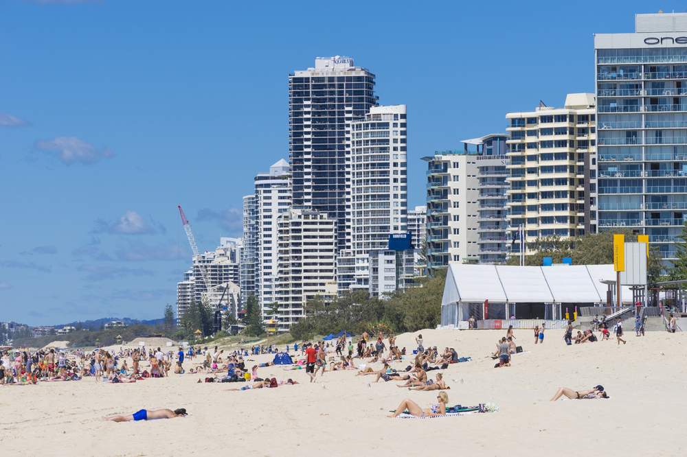 Australians&#39; love of the beach may be part of the reason for our high skin cancer rates (Photo credit: iStock\/ymgerman).