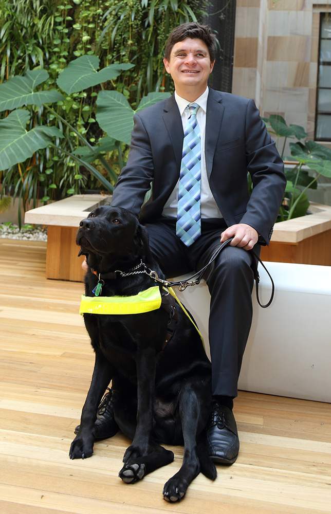 Dr Paul Harpur with his dog Chester. Dr Paul Harpur with his dog Chester.