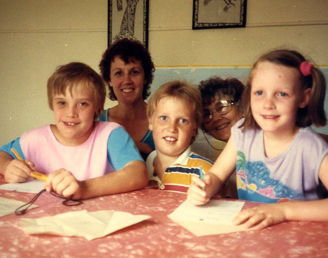 Original program participant Malcolm Vass (left) with his family and Dr Patricia Gunn (second from right)
