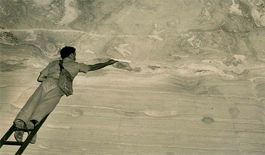  Ross Staines measuring the footprints 4.5 metres above the cave floor (c. 1954).