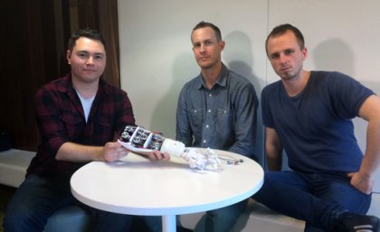 UQ Robotics Club members Fabian Vasuain and Lex Van Cooten with amputee consultant Ben Tarbuck (centre).