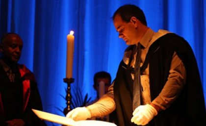 Reading names from the Book of Remembrance at the 2014 UQ Thanksgiving Ceremony. Photograph: Reading names from the Book of Remembrance at the 2014 UQ Thanksgiving Ceremony.