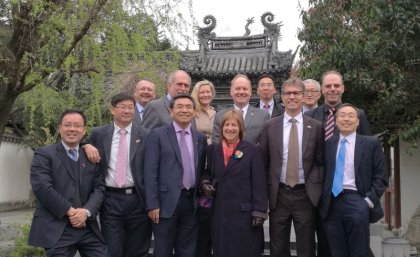 The group of executives after the signing, in Shanghai's Yuyuan Garden. 
