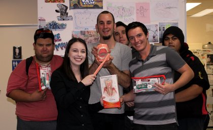 Nicole Cockburn of UQ Dentistry (front) with clients and staff from Brisbane Youth Services, the venue for Dental Rescue Week.