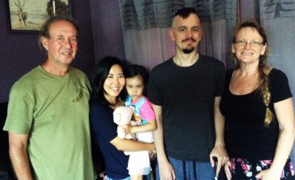 Leigh Sainty and his mother Rose (right), with wife Yuka, daughter Momo and stepfather Stuart McKenzie (left)