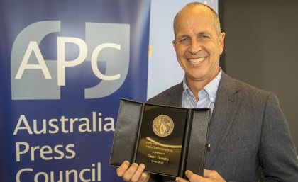 Peter Greste with his award