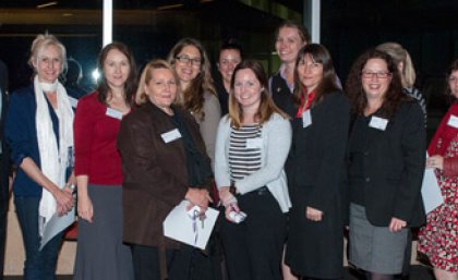 Chancellor Mr John Story presents 2013 Miracle Worker awards to group winners from the Faculty of Social and Behavioural Sciences. (<i>Back from left:</i> Sally Clark, Christine McCoy, Heidi Hood, Erin Zielke, Bianca Ohlson, Holly Dennis. <i>Front from left:</i> Kaylene Power, Chloe Burton, Melinda Conlan, Jane Fisher, Rachelle Croton.)