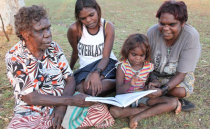 Sylvia Inverway and her daughters reading the new book with one of the authors Violet Wadrill (Photo: Penny Smith)