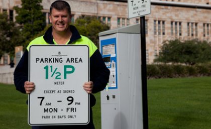 UQ Infrastructure Support Officer Gavin Campbell reveals the new campus parking signs that are in line with Brisbane City Council sign designs. UQ Infrastructure Support Officer Gavin Campbell reveals the new campus parking signs that are in line with Brisbane City Council sign designs.