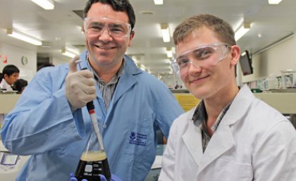 UQ's Dr James Fraser and student Cody Price dabble in the art of Guinness beer brewing.