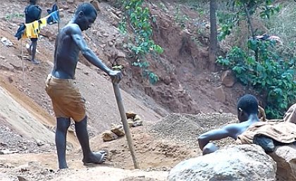 Small-scale miners sifting through crushed rock in Sierra Leone. Image supplied courtesy of the Sierra Leonean Broadcasting Company