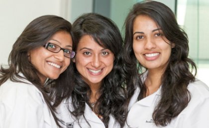UQ first year pharmacy students Ms Ila Patel (accelerated student); Ms Natasha Kissoon and Ms Mandeep Kaur Rao (accelerated students) received their white coats at a recent welcoming ceremony.