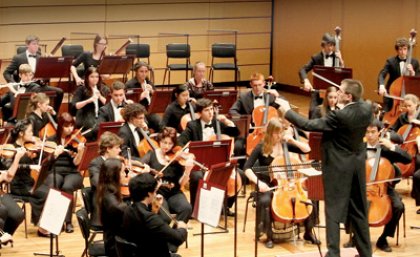 UQ Symphony Orchestra with conductor, Warwick Potter.