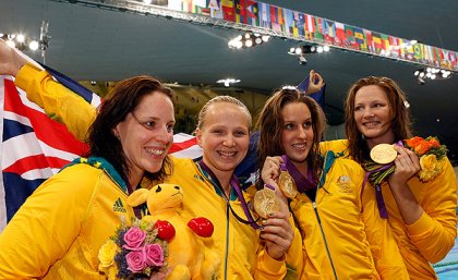 From left: Alicia Coutts, Melanie Schlanger, Brittany Elmslie and Cate Campbell pose with their gold medals after winning the women's 4x100m freestyle relay final. Image AAP/EPA