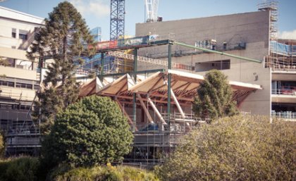 The Advanced Engineering Building roof is lifted into place. The Advanced Engineering Building roof is lifted into place.