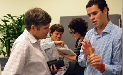 Chilean engineering student Samuel Valdes (right) discusses a research project with Professor Paul Strooper, Head of School, Information Technology and Electrical Engineering.