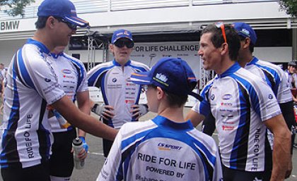 UQ student Jefferson Mac (left) meets Ride for Life Challenge ambassador Robbie McEwen after the race