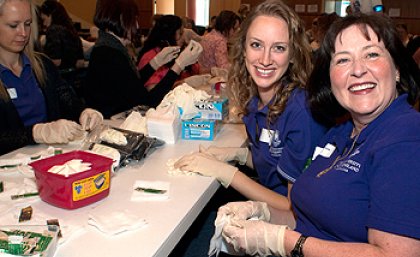 Midwifery student Kimberley Retschleg and Bachelor of Midwifery and Dual Degree Coordinator Susannah Brady prepare birthing kits Midwifery student Kimberley Retschleg and Bachelor of Midwifery and Dual Degree Coordinator Susannah Brady prepare birthing kits
