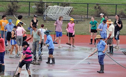 Volunteers help clean up the UQ Athletics Centre at St Lucia following the floods Volunteers help clean up the UQ Athletics Centre at St Lucia following the floods