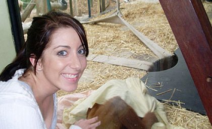 UQ student Danielle Nilsson with an orangutan at Melbourne Zoo UQ student Danielle Nilsson with an orangutan at Melbourne Zoo