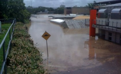 Floodwaters over Glasshouse Road at UQ's St Lucia campus. Picture: Geoff Dennis. Floodwaters over Glasshouse Road at UQ's St Lucia campus. Picture: Geoff Dennis.