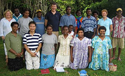 Professor Ian Frazer (back centre) and Clinical Trials Research Manager James Pang (front left) in Vanuatu with the health team and local teachers
