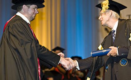 Dr White (left) receiving his PhD from Chancellor Sir Llew Edwards last December Dr White (left) receiving his PhD from Chancellor Sir Llew Edwards last December