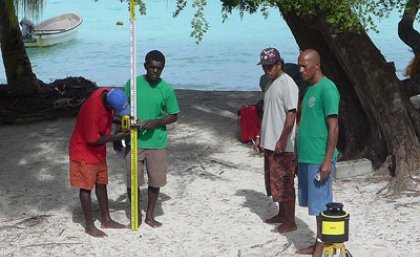 Global Change Institute scientists are working with local communities to monitor sea level rise in the Solomon Islands, a region which has experienced some of the highest climate change-related sea level rise in the world. Photo: Dr Javier Leon.