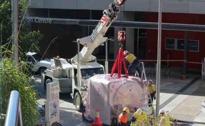 Siemens' workers prepare Australia's first PET/MRI hybrid scanner to be lowered into UQ's Centre for Clinical Research. Siemens' workers prepare Australia's first PET/MRI hybrid scanner to be lowered into UQ's Centre for Clinical Research.