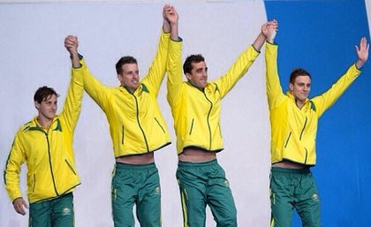 UQ student Tommaso D'orsogna (far right) with teammates after winning gold in the men's 100m freestyle relay. Photo courtesy of @tommasodor