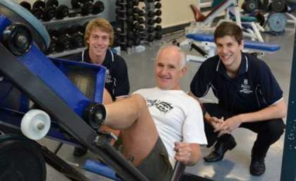 Prostate cancer survivor, John Brady, participating in exercise session with UQ Clinical Exercise Physiology students Nicholas Edwards(left) and Daniel Harth (Right)