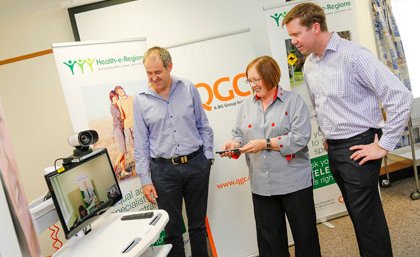 QGC Vice President Sustainability, Brett Smith and Ms Ruth Saunders and Deputy Director for the Centre for Online Health, A/Prof Anthony Smith, discuss the Health-e-Regions project. QGC Vice President Sustainability, Brett Smith and Ms Ruth Saunders and Deputy Director for the Centre for Online Health, A/Prof Anthony Smith, discuss the Health-e-Regions project.