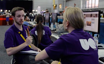 Students Andrew Thorpe, Bo Daly and Evangelene Dickson inside the media centre at the G20. Photo: Genevieve Worrell.