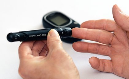 A diabetic performs a pin-prick test.