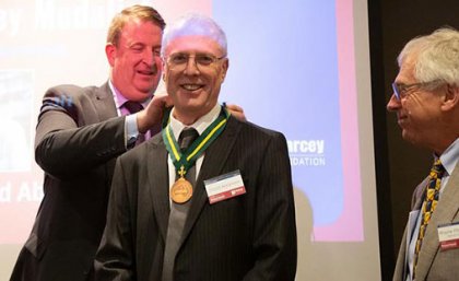 CSIRO’s Nigel Warren (left) presented Professor Abramson (centre) with the Pearcey Medal, as foundation chairman Wayne Fitzsimmons (right) looked on. CSIRO’s Nigel Warren (left) presented Professor Abramson (centre) with the Pearcey Medal, as foundation chairman Wayne Fitzsimmons (right) looked on.
