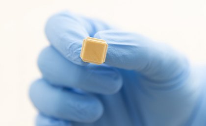 An image of the Vaxxas high-density microarray patch (HD-MAP) technology, showing a small patch containing thousands of microprojections.