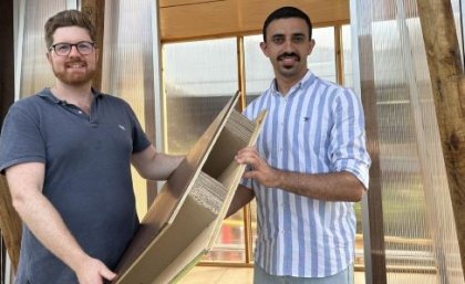 Associate Professor Joe Gattas (left) and PHD student Mahmoud Abu-Saleem with one of their timber-cardboard web-core sandwich (TCWS) panels. UQ researchers Associate Professor Joe Gattas (left) and PHD student Mahmoud Abu-Saleem with one of their timber-cardboard web-core sandwich (TCWS).