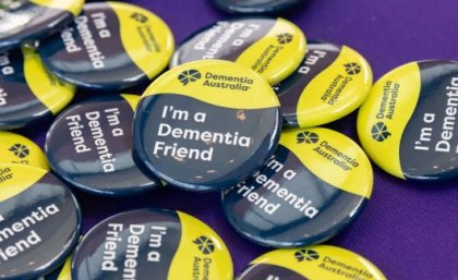 Close up of a button that says 'I'm a dementia friend'
