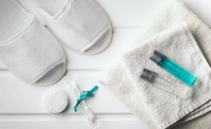 Single use. white slippers, hand towels and mini shampoo bottles.