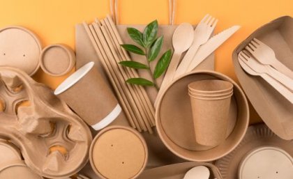 a pile of brown boxes, cups and utensils