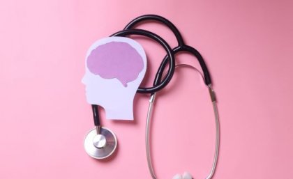New international guidelines on the use of anti-psychotic drug clozapine have been developed. Image: Adobe. Stethoscope and stylised human head and brain on pink background.