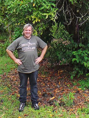 Dr Craig Hardner with a macadamia tree in Hawaii