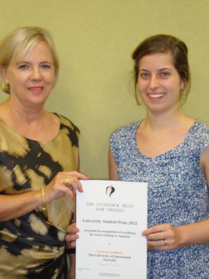 Speech Pathology Honours graduate Victoria Sandham receives award from Head of the Division of Speech Pathology, Professor Deborah Theodoros.