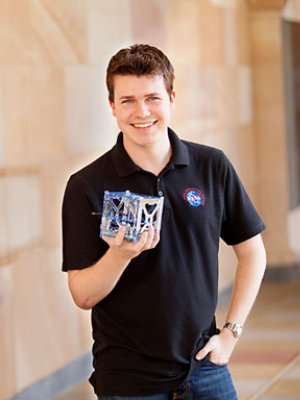 Michael Kehoe, UQ final year student of the School of Information Technology and Electrical Engineering. Pictured with his final year thesis project, a satellite that uses Android mobile phone technology as its on-board computer. Michael has recently completed a five week-internship with NASA. He has built a phonesat that will be launched by NASA into space on November 25.