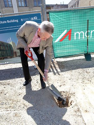 Visionary philanthropist Graeme Wood buries a piece of coal in front of the construction site of the Global Change Institute Living Building at St Lucia Visionary philanthropist Graeme Wood buries a piece of coal in front of the construction site of the Global Change Institute Living Building at St Lucia