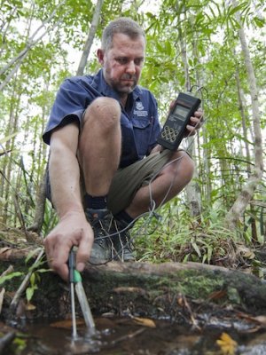 Professor Craig Franklin measuring pH in a tributary of the Wenlock River, on the Steve Irwin Wildlife Reserve in northern Queensland.