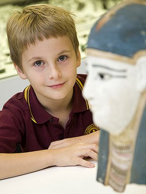 James Hudson in the UQ Antiquities Museum with the 2400-year-old Egyptian mummy mask he voted for in the Treasures competition