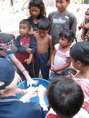 UQ students complete a hand washing demonstration with children in Siem Reap, Cambodia. Image: Peta Crompton