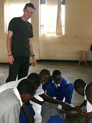 UQ medical student Sean Mitchell working with high school students in Rwanda
